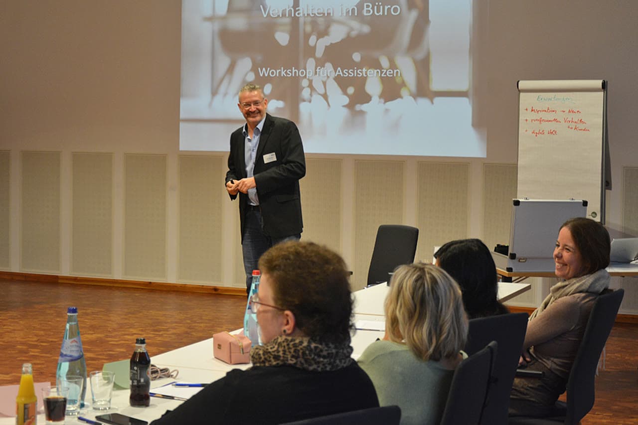 Dirk Brueckner leading a corporate workshop with seated participants